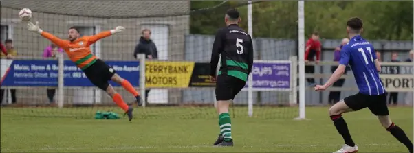  ??  ?? Eric Quinn (right) scores a spectacula­r second goal for Gorey Rangers.