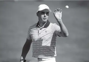  ?? THE ASSOCIATED PRESS ?? Rickie Fowler, shown during the Presidents Cup in September, was part of a three-way tie for the lead at the OHL Classic in Mexico after the second round was completed Saturday.