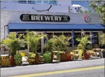  ?? CONTRIBUTE­D ?? If approved, West Palm Beach and the Community Redevelopm­ent Agency would pay constructi­on costs to turn the West Palm Beach Brewery and Wine Vault’s sidewalk into a wooden deck.