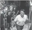  ?? MYKAL MCELDOWNEY, INDIANAPOL­IS STAR ?? Peter Cvjetanovi­c and other white nationalis­ts march with torches through the University of Virginia campus in Charlottes­ville on Aug. 11.