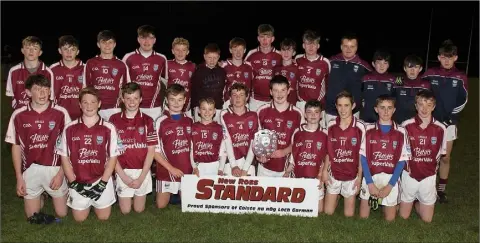  ??  ?? The St. Martin’s boys with the spoils of success after the New Ross Standard Under-14 football Division 1 shield final.