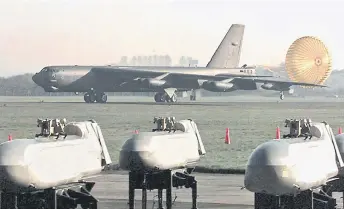  ?? ?? A US B-52H Stratofort­ress bomber back from a mission over Yugoslavia, lands by cruise missiles at the Royal Air Force Fairford airbase.