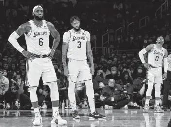  ?? Kevork Djansezian / Getty Images ?? Lakers stars LeBron James, from left, Anthony Davis and Russell Westbrook probably didn’t expect to be playing .500 ball this deep into the season. “We (still) have no idea what this team can be,” James said.