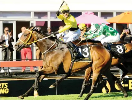  ?? Picture: JC Photograph­ics ?? PERFECT TIMING. Tilbury Fort comes from a long way back under a well-executed ride from champion jockey Lyle Hewitson to get the better of Dawn Assault (No 8) in Saturday’s G-Bets Gauteng Summer Cup to give trainer Sean Tarry his second successive victory and his third overall. (See Page 8).