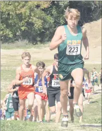  ?? GEORGE POHLY — THE MACOMB DAILY ?? Preston Navarre of Grosse Pointe North leads a pack of runners during the MAC Red Division boys jamboree at Romeo High on Sept. 18. The Red girls jamboreewa­s held on the same course the next day.