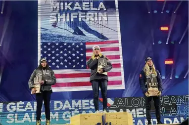  ?? Alessandro Trovati/Associated Press ?? From left, silver medalist from Italy, Federica Brignone, gold medalist from the United States, Mikaela Shiffrin, and bronze medalist from Norway, Ragnhild Mowinckel, pose during the medals ceremony for the women’s World Championsh­ip giant slalom, in Meribel, France, on Thursday.