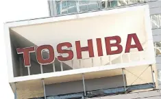  ??  ?? A logo of Japan’s Toshiba is seen at the company’s headquarte­rs in Tokyo. Toshiba shares dived more than nine per cent on February 14 after it surprised markets by delaying the release of financial results that were expected to include billions of...