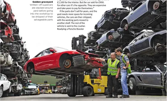  ??  ?? Golden graveyard Written-off supercars are stacked around yard before going into the workshop to be stripped of their salvageabl­e parts