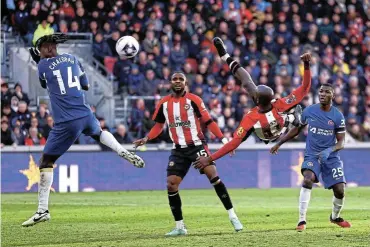  ?? Picture: Warren Little/Getty Images ?? Yoane Wissa of Brentford scores his team's second goal with an overhead kick during the Premier League match against Chelsea at the Brentford Community Stadium in England yesterday.