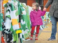  ??  ?? MUCH-LOVED: Supporters left jerseys and scarves in tribute.