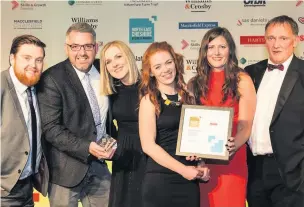  ??  ?? Boxed Red receiving the award for Team of the Year at the last business awards in 2016, presented by David Taylor of Harts