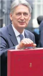  ??  ?? > Philip Hammond presenting his Budget proposals just a week ago