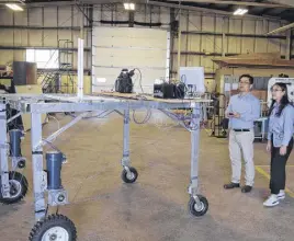  ?? FRAM DINSHAW/TRURO NEWS ?? Professor Young Ki Chang and his student Qilin Yu are testing a robot camera to detect weeds and plant diseases on farms.