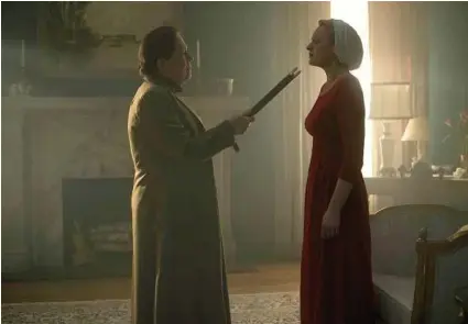  ?? George Kraychyk / Hulu ?? “The Handmaid’s Tale” — a tale of a dystopian, quasi-post-apocalypti­c world — has a disturbing­ly suffocatin­g contempora­ry feel.