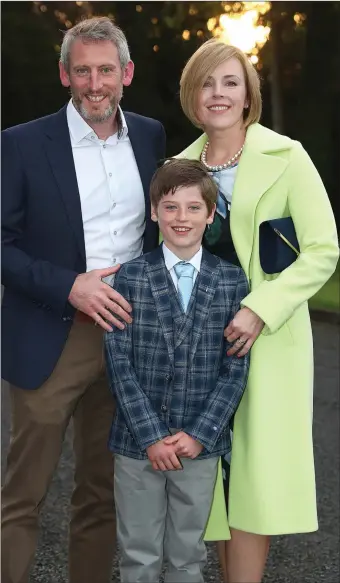  ??  ?? Louis Maguire with his parents Terence and Anna Maria in Termonfeck­in.