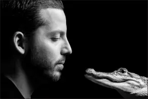  ?? Courtesy of David Blaine ?? David Blaine is shown with the alligator he uses in his street-magic act. The illusionis­t is bringing his act to Resort World this September.