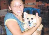  ?? FAMILY PHOTO ?? Nicole Ganguzza, shown holding a dog, was attacked while jogging along the Little Econ Greenway Trail in June 2008. Her killing remains unsolved. Authoritie­s hope new security cameras will help deter crime on the trails.