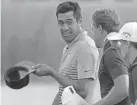  ?? TIMES-PICAYUNE/THE NEW ORLEANS ADVOCATE VIA AP ?? Tony Finau chats with teammate Cameron Champ at the end of the second round of the Zurich Classic in Avondale, La., Friday. MAX BECHERER/THE