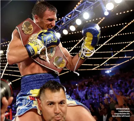  ?? Photo: MIKEY WILLIAMS/TOP RANK ?? UNTOUCHABL­E: Lomachenko congratula­tes his incredible left hand