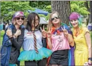  ??  ?? A group of friends gets colorfully creative at this year’s Pride Festival, held June 4.