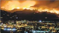  ?? SMOKE BILLOWS Marcus Yam Los Angeles Times ?? above Santa Paula from 2019’s Maria fire, which sparked after shut-off power lines were turned back on.