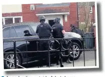  ??  ?? ●●Armed police outside John’s home