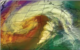  ?? NASA ?? A satellite view of the “bomb cyclone” moving over the Midwest on Wednesday night.