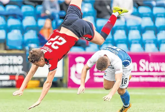  ??  ?? Dundee centre-back Jack Hendry was taken out by Kilmarnock midfielder Calum Waters in Saturday’s 1-1 draw in Ayrshire.