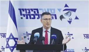  ?? (Marc Israel Sellem/The Jerusalem Post) ?? GIDEON SAAR addresses his faction in the Knesset yesterday.