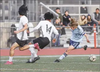  ?? Chris Torres/ The Signal ?? Saugus midfielder Gage Fritz (11) pushes the ball upfield the second half of a Foothill league match against Canyon at Saugus High School on Thursday. Saugus won 4-0.