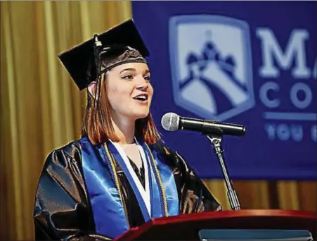  ?? SUBMITTED PHOTO — MANOR COLLEGE ?? Marta J. Penjalskyj, a graduating member of the Class of 2018, delivers a commenceme­nt oration at Manor College’s commenceme­nt ceremony May 17.