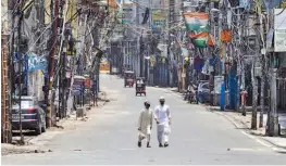  ?? — PTI ?? Sadar Bazaar market area wearas a deserted look, ahead of its reopening, as part of government’s order of gradual unlocking of Covid-induced restrictio­ns in New Delhi on Sunday.