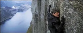  ?? PARAMOUNT PICTURES ?? Tom Cruise’s Ethan Hunt hangs from a cliff in the new “Mission: Impossible — Fallout” — a moment that’s likely a nod to a scene from 2000’s “Mission: Impossible 2.”
