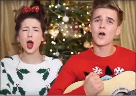  ??  ?? HIGH NOTES: Joe and Zoe sing Christmas songs on his YouTube channel