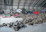  ?? AFP ?? Abandoned Afghan Air Force aircraft and armoured vests are seen at the Kabul airport.