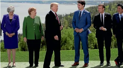  ??  ?? US president Donald Trump, third from left, with fellow G7 members, from left, British PM Theresa May, German Chancellor Angela Merkel, Canadian PM Justin Trudeau, French President Emmanuel Macron and Japanese Prime Minister Shinzo Abe.