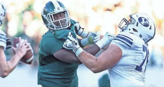  ?? MIKE CARTER / USA TODAY SPORTS ?? Michigan State’s Malik McDowell played multiple positions along the defensive line, but will likely be a tackle in the NFL.