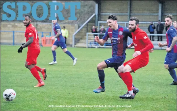  ??  ?? LRFC’s Liam Read (blue) and AFC’s Sam Belcher (red) battle for the ball at the weekend