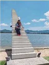  ??  ?? Called the Stairway to Heaven, the white flight of stairs near the island's beachfront is a popular Instagram backdrop.