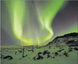  ?? Rene Rossignaud The Associated Press file ?? The Northern Lights, or aurora borealis, appear in March 2017 over Bifrost, Iceland. Police in Iceland say tourists are often putting themselves at risk searching for the spectacula­r streaks of color that light up the winter skies.