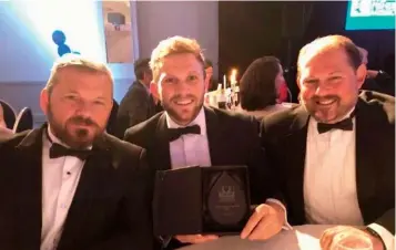  ?? Photo: Humber Business.com ?? Above: Steven, Reece and Richard Stansfield with the Fish Processor of the Year Award 2018