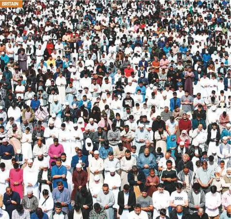  ?? Reuters ?? Around 140,000 Muslims attend Eid Al Fitr prayers in Small Heath Park in Birmingham yesterday.