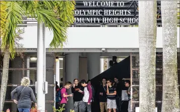  ?? LANNIS WATERS / THE PALM BEACH POST ?? Students at Olympic Heights High School in Boca Raton are seen Feb. 19 after some of them walked out to protest gun violence, five days after the massacre at Marjory Stoneman Douglas High in Parkland.