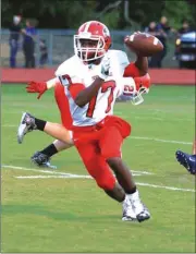  ?? LARRY GREESON / For the Calhoun Times ?? Sonoravill­e quarterbac­k Patrick Moore rolls out during his team’s preseason scrimmage against Gordon Central.