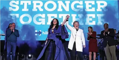  ??  ?? Democratic presidenti­al nominee former Secretary of State Hillary Clinton (right) raises her arms with recording artist Katy Perry (left) during a get-out-the-vote concert at the Mann Center for the Performing Arts. — AFP photos