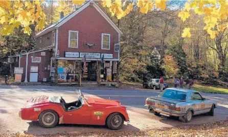  ?? DANNY G. TAYLOR ?? Cars participat­e in the Great American Mountain Rally Revival, now run in October in New England. Few owners of vintage vehicles are willing to expose them to the bad weather.