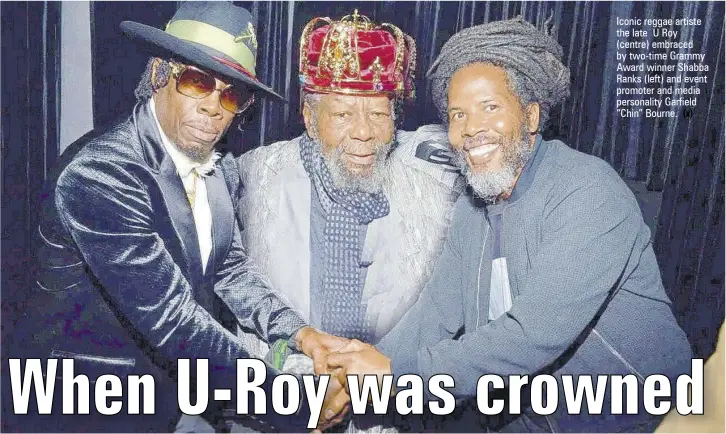  ?? (x) ?? Iconic reggae artiste the late U Roy (centre) embraced by two-time Grammy Award winner Shabba Ranks (left) and event promoter and media personalit­y Garfield “Chin” Bourne.