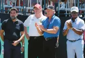  ?? AP 2022 SETH WENIG/ ?? Yasir Al-rumayyan, from left, head of Saudi Arabia’s sovereign wealth fund, former President Donald Trump, LIV Golf CEO Greg Norman and Majed Al-sorour, CEO of Golf Saudi, attend a LIV event at Trump’s club in Bedminster, N.J.