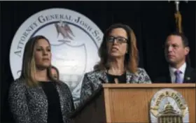  ?? JACQUELINE LARMA/ASSOCIATED PRESS ?? Patty Fortney, center, and Carolyn Fortney, left, Harrisburg-area clergy abuse victims, participat­e in a news conference alongside Pennsylvan­ia Attorney General Josh Shapiro Friday Oct. 12, in Norristown, Pa. Shapiro is appealing to legislator­s to change state law so that civil cases can be pursued in court in decades-old clergy abuse cases. Shapiro also wants the Legislatur­e to lift the statute of limitation­s for criminal prosecutio­ns going forward.