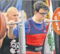  ?? DESIREE ANSTEY/ JOURNAL PIONEER ?? In front of an enthusiast­ic crowd at Credit Union Place, Griffin Wakelin lifts 200 kilograms in the men’s sub junior 105-kilogram class. Wakelin was one of nearly 60 competitor­s in the 2017 P.E.I. powerlifti­ng and bench-press championsh­ips recently.